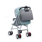 Wickelhandtasche Chick am Kinderwagen befestigt